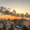 Smoke billows over apartment buildings in Khartoum.