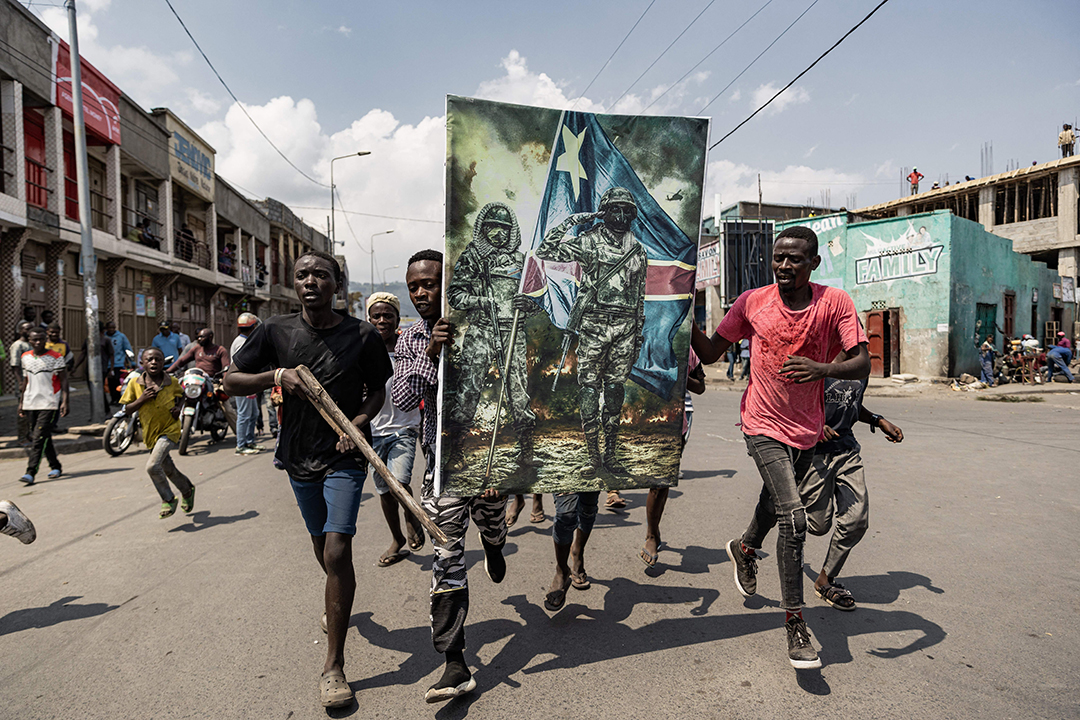 Demonstrators carry a poster honoring the Democratic Republic of Congo armed forces during a protest in Goma, June 15, 2022. Several thousand people demonstrated to denounce "Rwandan aggression."